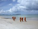 Cambodia,
Sihanoukville, June 2003.
Buddhist beach.
Buddhist monks walking on the beach.  

